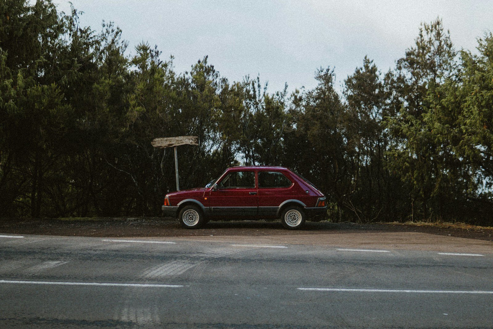 a red car parked on the side of the road