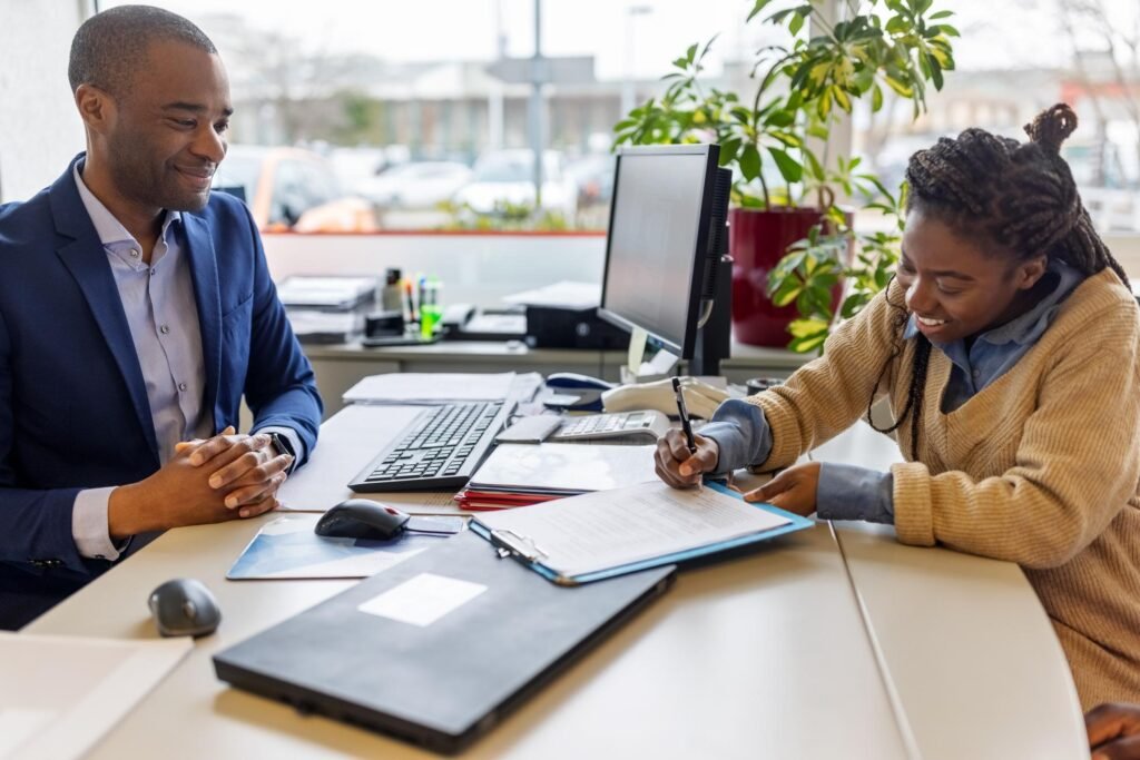 Car buyer discussing financing and an 84-month auto loan at a dealership