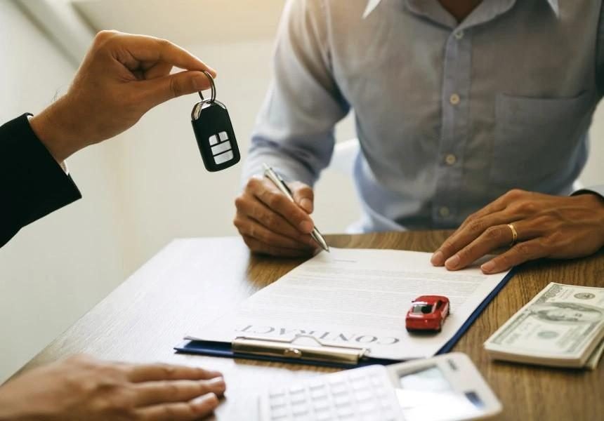 Car loan paperwork illustrating negative equity on a vehicle